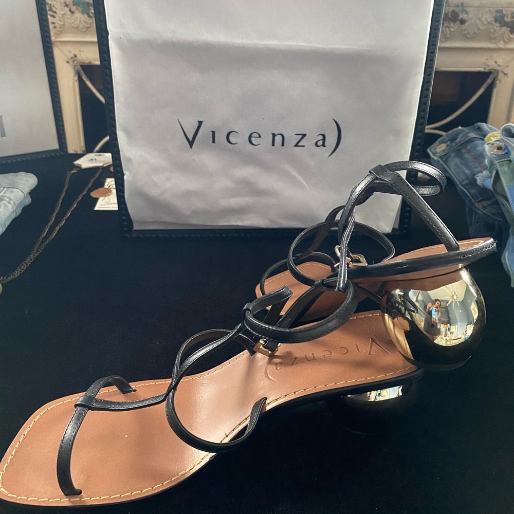 Black shoes with round gold heel; worn once can be dressed up or down; size 39/9